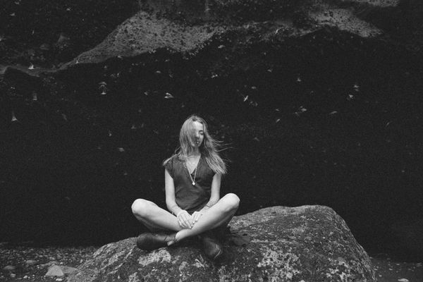 Close up of a muscular man breathing deeply outdoors