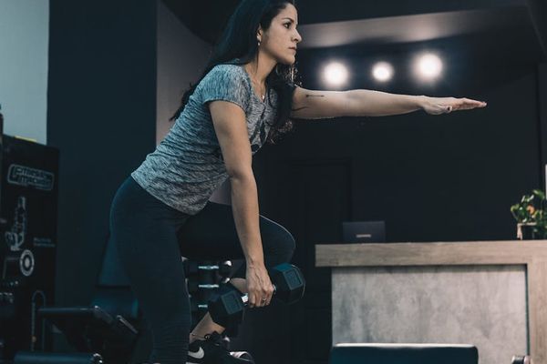 Man balancing on one leg during a strength training session
